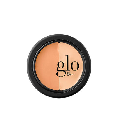 Sort dåse med gennemsigtig cover og rige farver. Glo Under Eye Concealer - Sand