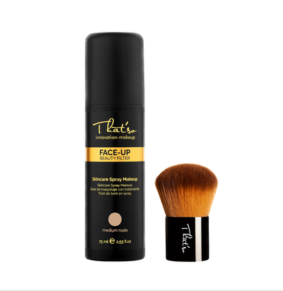 Luksuriøs sort That´so Face-Up flaske med guldbånd og logo. En stilfuld makeup børste er placeret ved siden af.