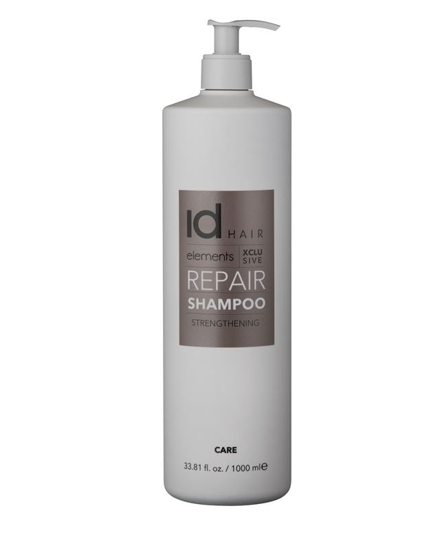Stilsikker hvid flaske med bronze etiket og pumpe. Id Hair Repair Shampoo..