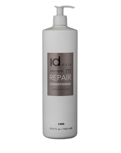 Stilsikker hvid flaske med bronze etiket og pumpe. Id Hair Repair Conditioner.